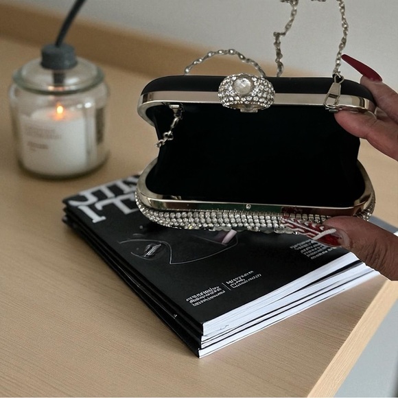 Beautiful rhinestone ring clutch purse.  The purse comes with a strap.